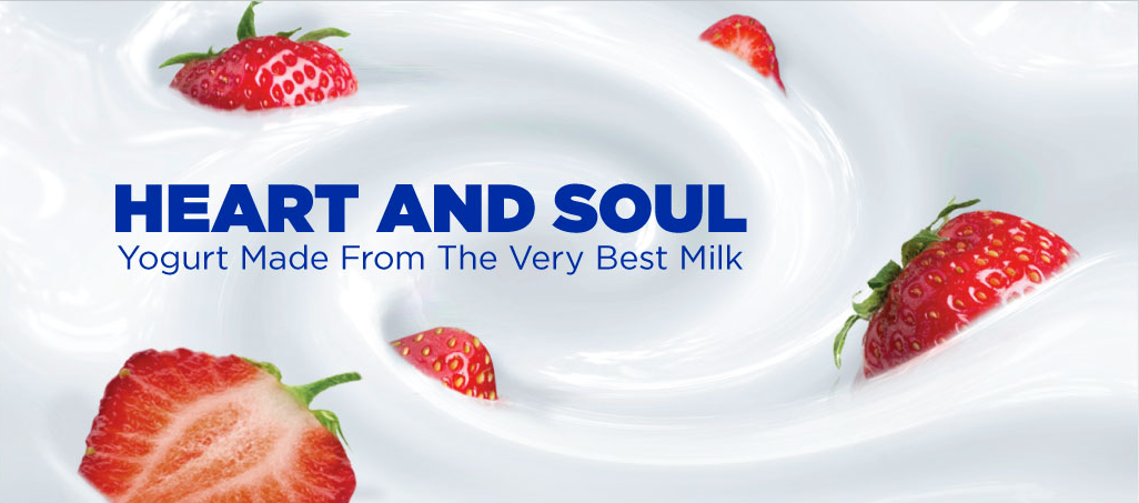 Strawberries in yogurt with text reading: Heart and Soul: Yogurt Made From the Very Best Milk